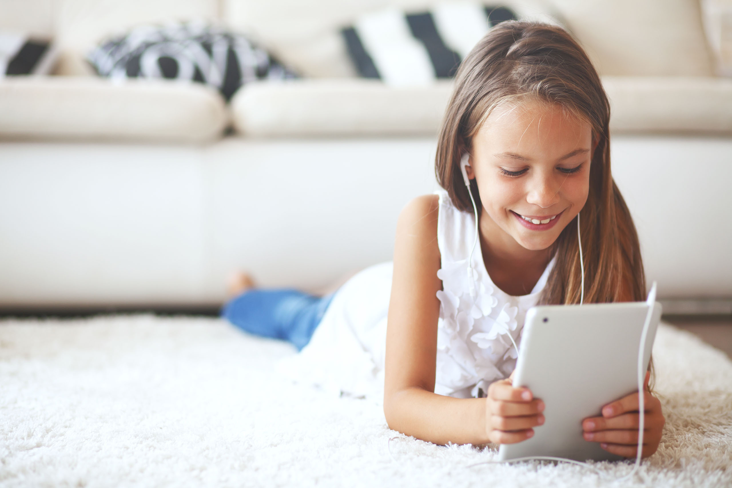 Home Page Slider - Child with iPad on Ground