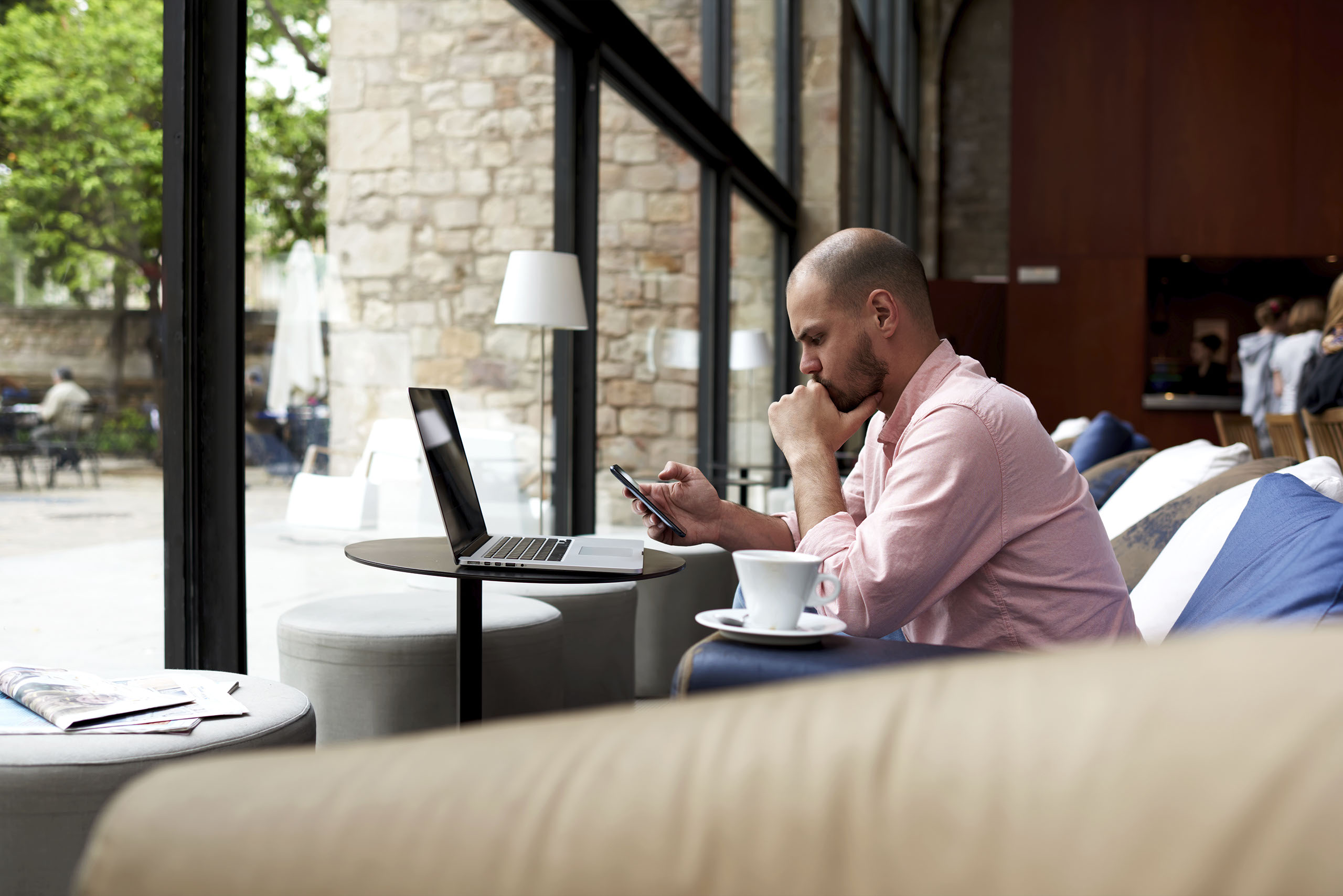 Home Page Slider - Man on MacBook in Shop